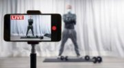ess-Trainer-Live-Streaming-A-Workout-On-His-Iphone.jpg