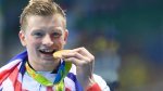 old-Medal-Swimmer-Adam-Peaty-Biting-His-Gold-Medal.jpg
