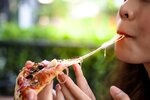 woman-eating-pizza-1024x683.jpg