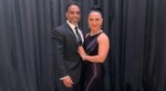 Tony-Roberts-in-a-suit-with-his-wife.jpg