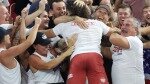 2022-NoBull-Crossfit-winners-hugging-the-crowd.jpg