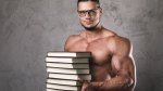 Muscular-Man-Wearing-Glasses-Holding-Stack-of-Books