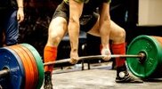 Powerlifter competing in a olympic weightlifting competition.